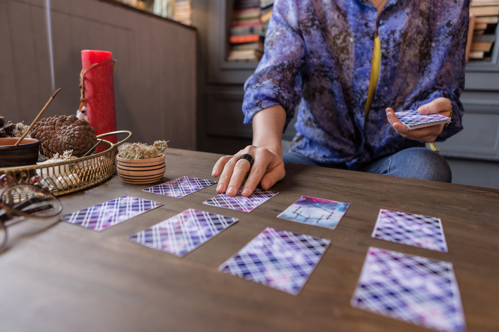 Woman Laying out Tarot Cards in a Spread