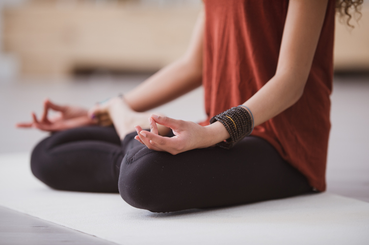 Young Woman Practicing Yoga at Home