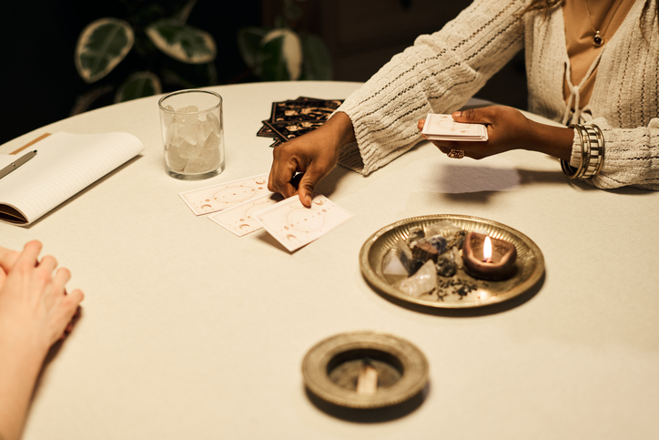 Woman Reading Tarot Cards for Client